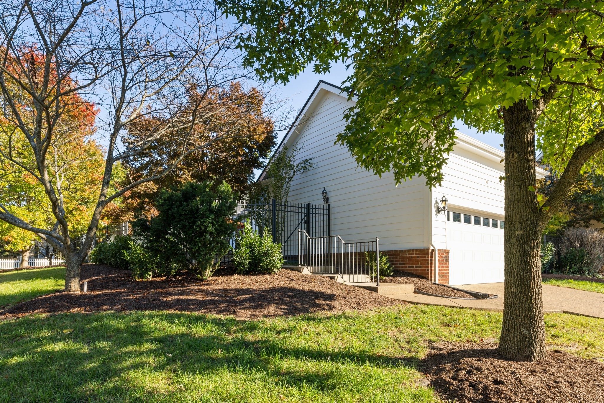541 Marigold Drive Franklin, TN 37064 - Photo 67 of 69 a backyard of a house with table and chairs under an umbrella