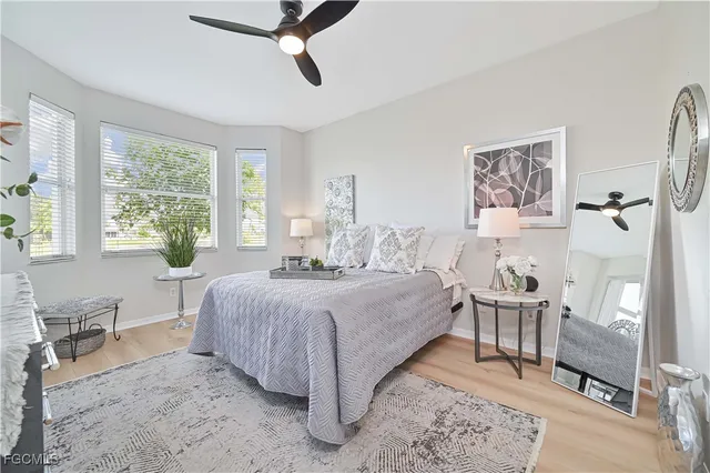 a bedroom with a large bed and a dresser