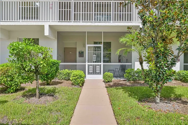 a view of a chairs and table in the balcony