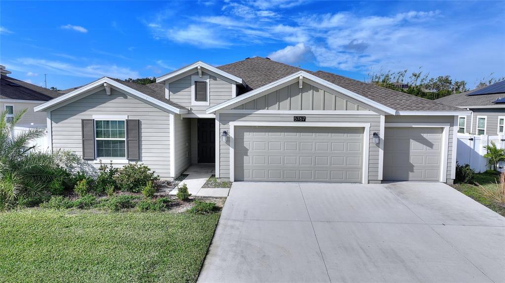 5767 Talc St Mount Mount Dora, FL 32757 - Photo 1 of 44 a front view of a house with yard and green space