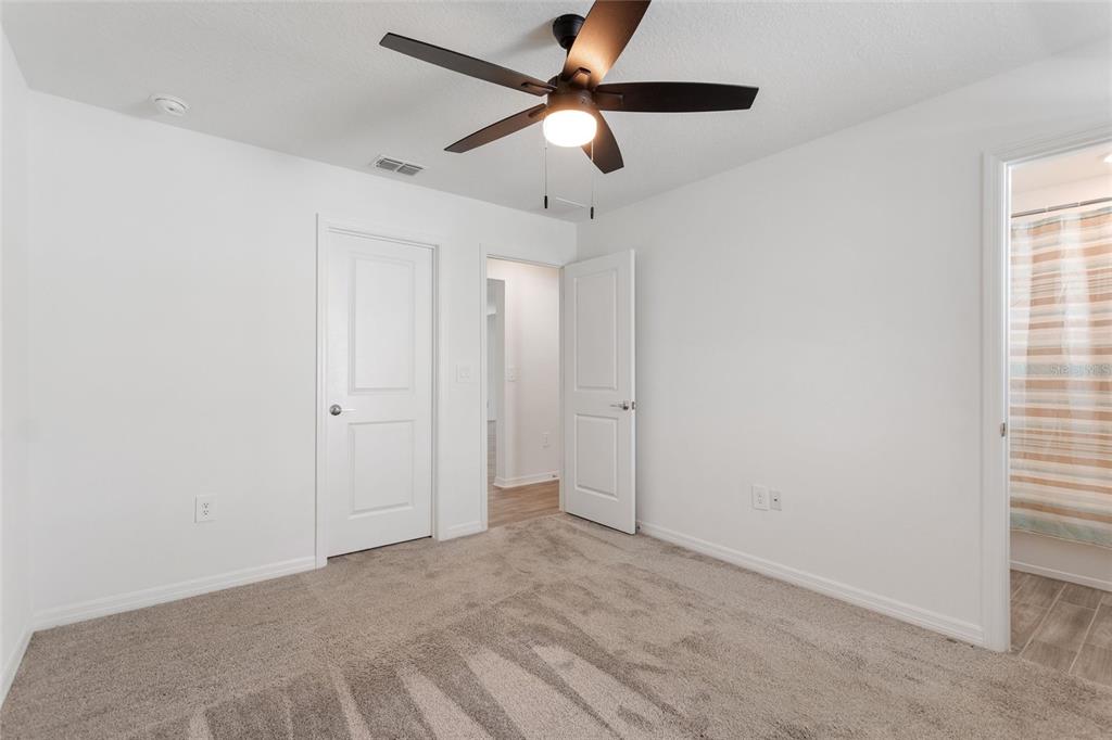 5767 Talc St Mount Mount Dora, FL 32757 - Photo 16 of 44 a view of an empty room and window with a fan