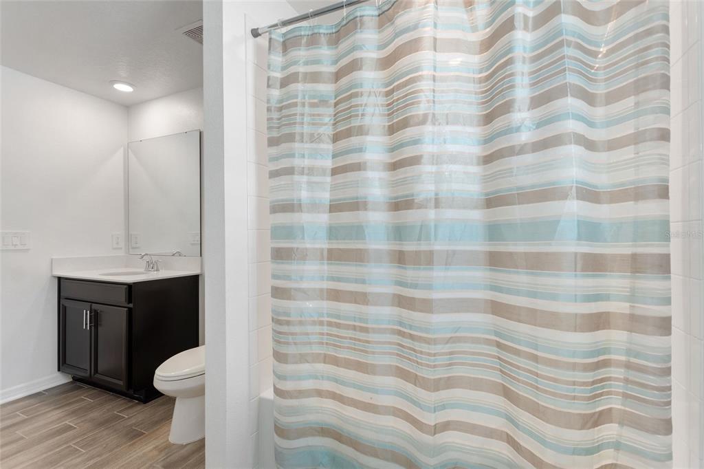 5767 Talc St Mount Mount Dora, FL 32757 - Photo 17 of 44 a bathroom with a sink toilet and shower