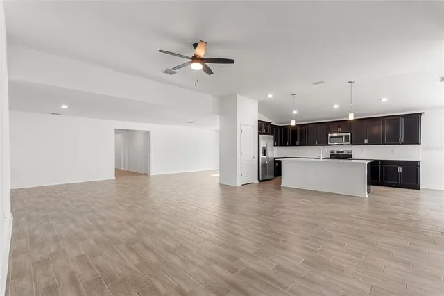a view of kitchen with cabinets and wooden floor