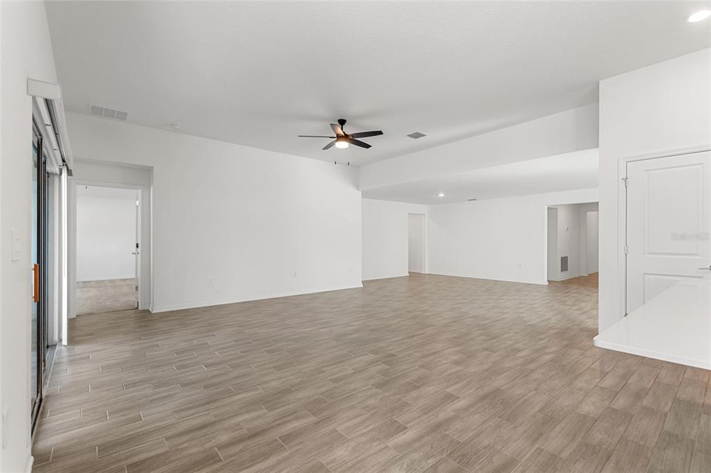 5767 Talc St Mount Mount Dora, FL 32757 - Photo 21 of 44 a view of an empty room with a ceiling fan