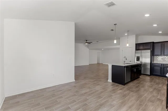 a view of kitchen with wooden floor