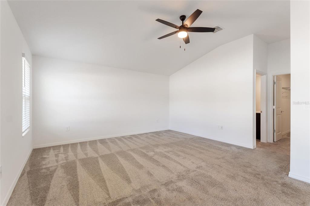 5767 Talc St Mount Mount Dora, FL 32757 - Photo 29 of 44 an empty room with a ceiling fan and a window