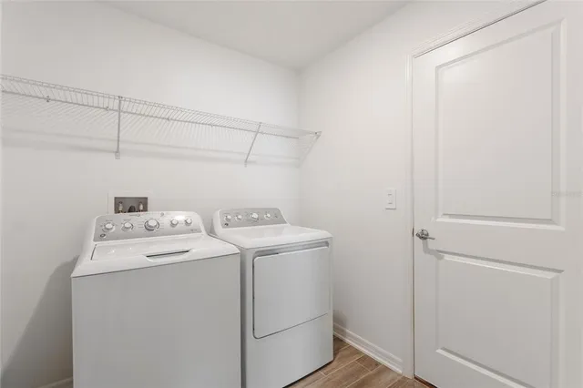 a utility room with dryer and washer