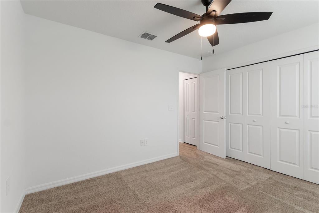 5767 Talc St Mount Mount Dora, FL 32757 - Photo 6 of 44 an empty room with chandelier fan