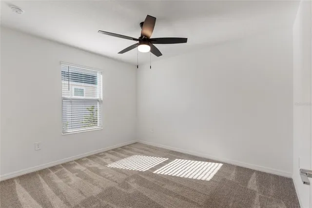 a view of empty room with windows