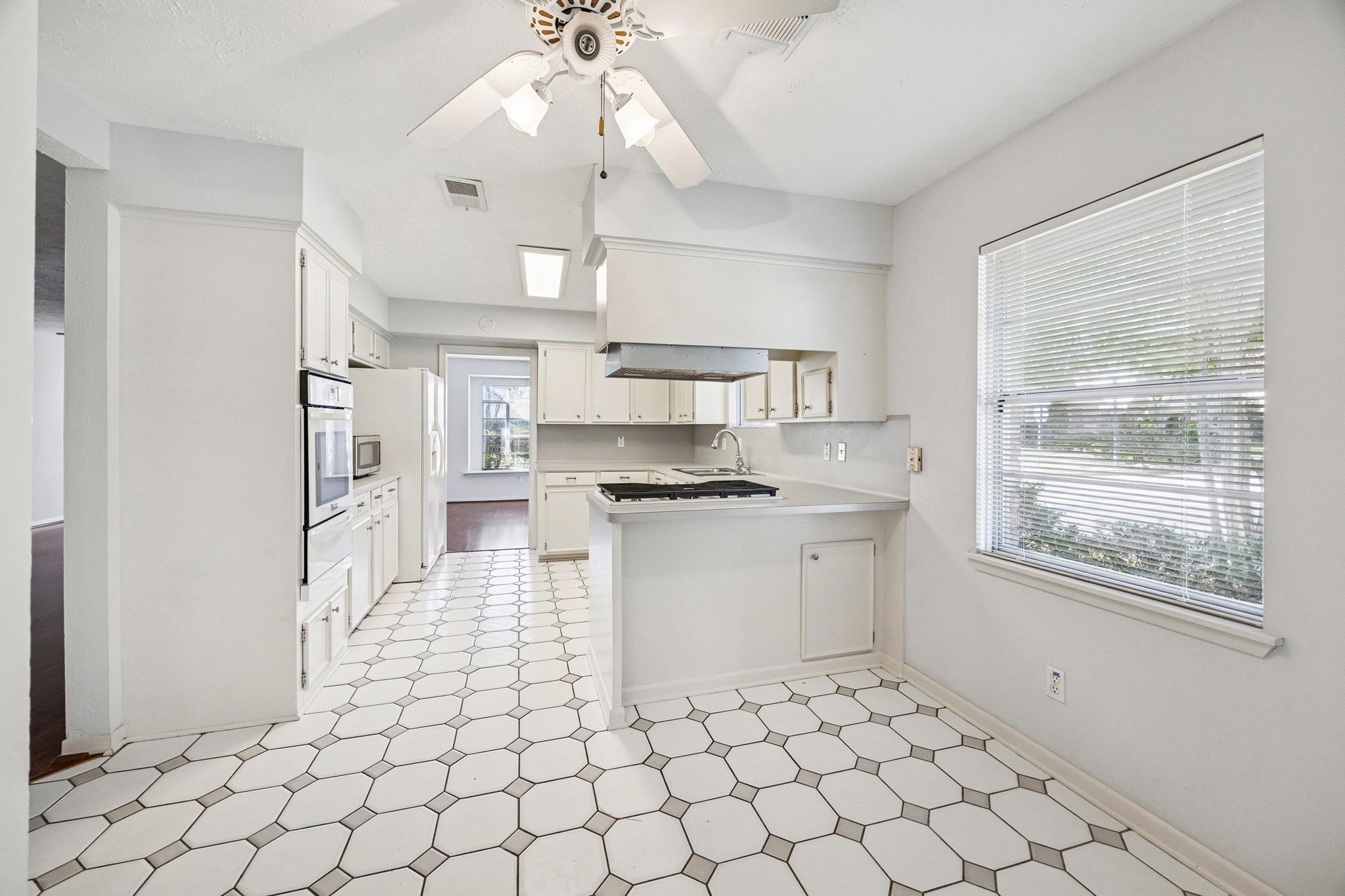 8730 Cedarspur Drive Houston, TX 77055 - Photo 13 of 23 a kitchen with stainless steel appliances granite countertop a refrigerator and a stove top oven