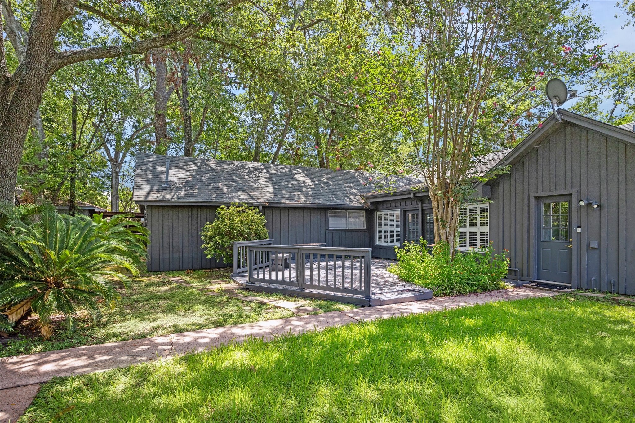 8730 Cedarspur Drive Houston, TX 77055 - Photo 2 of 23 a front view of a house with garden