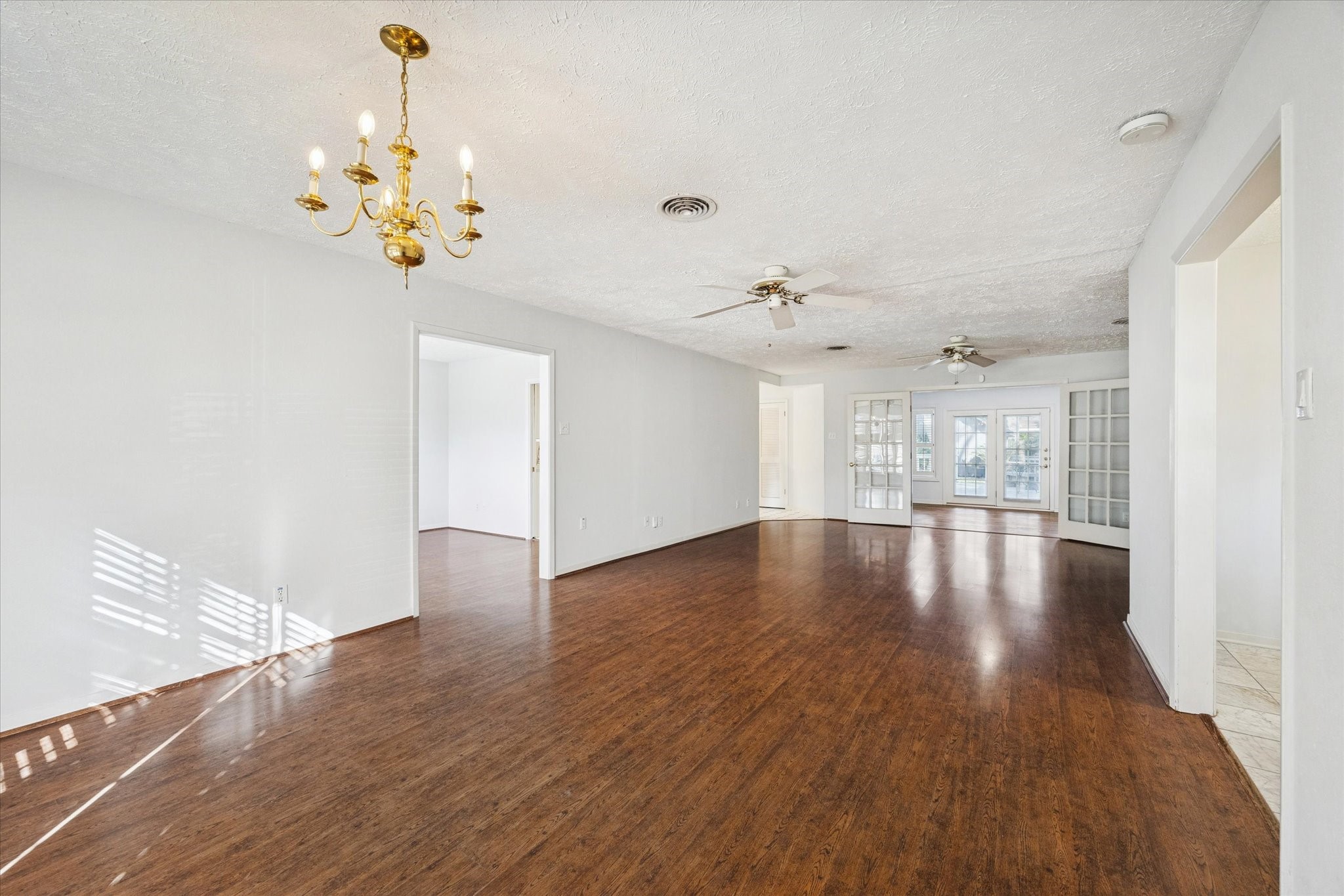 8730 Cedarspur Drive Houston, TX 77055 - Photo 4 of 23 a view of an empty room with wooden floor and a window