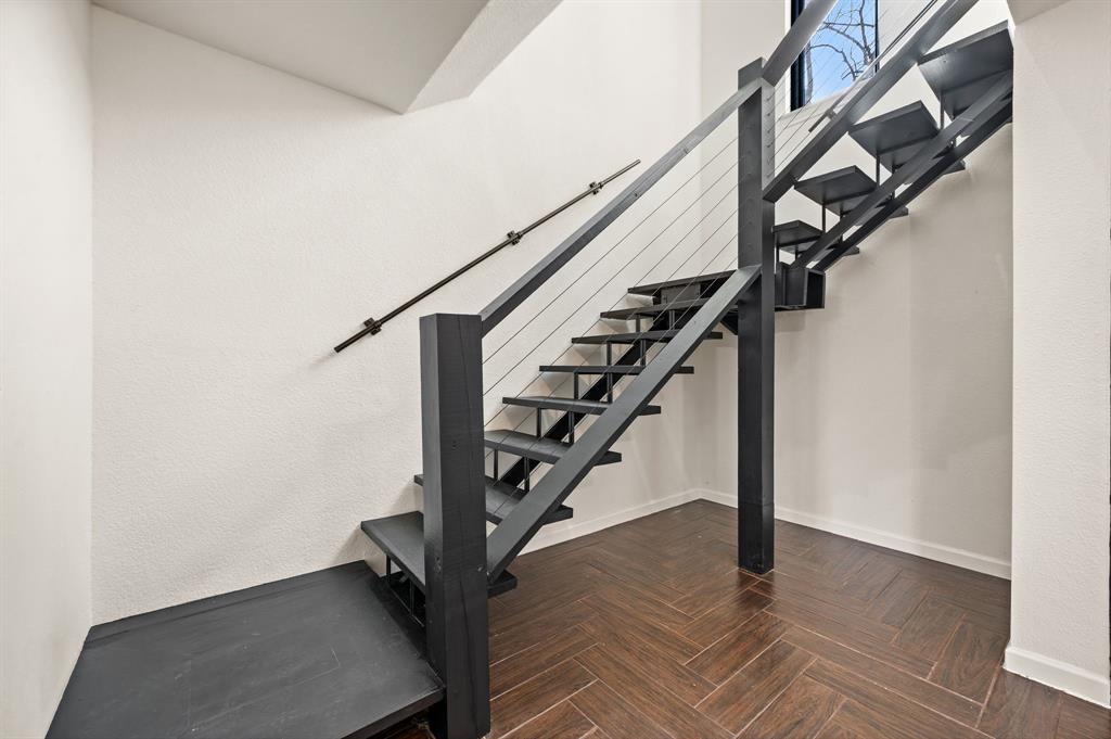 5009 Milam Street Dallas, TX 75206 - Photo 14 of 35 Staircase featuring parquet flooring and baseboards