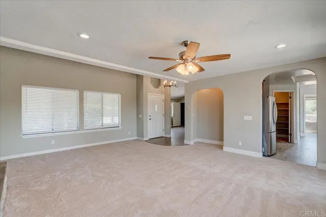 a view of an empty room with glass door