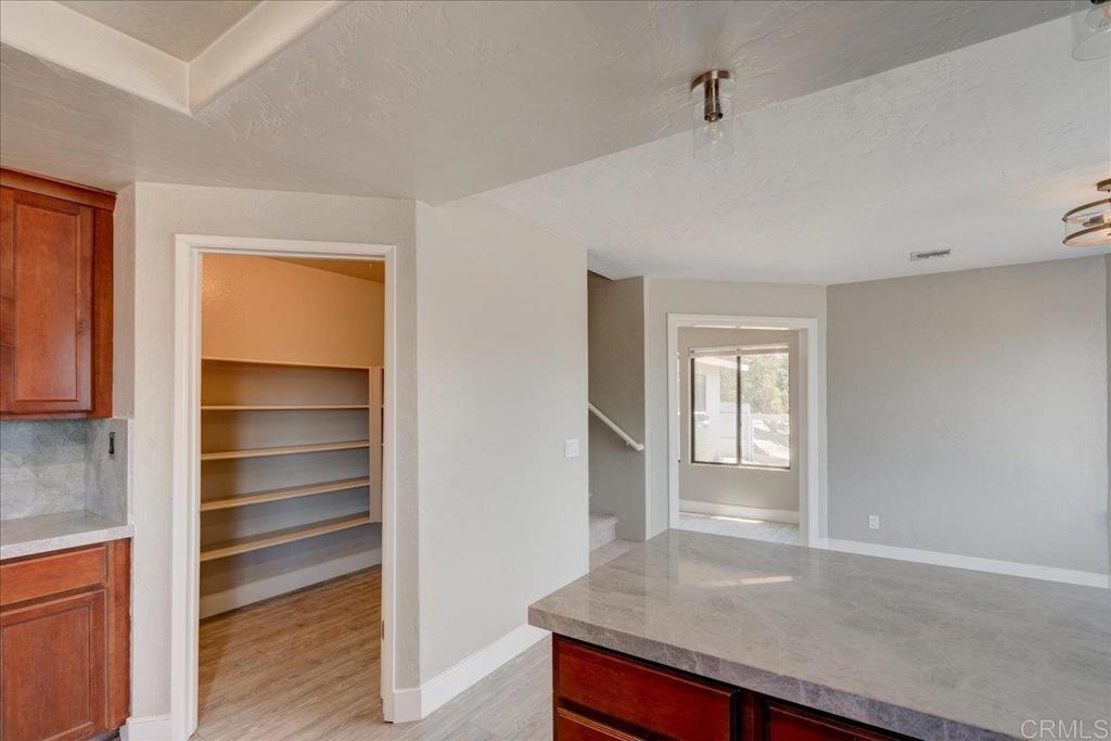 18434 Ramona View Drive Ramona, CA 92065 - Photo 21 of 72 a view of an empty room with wooden floor and a window