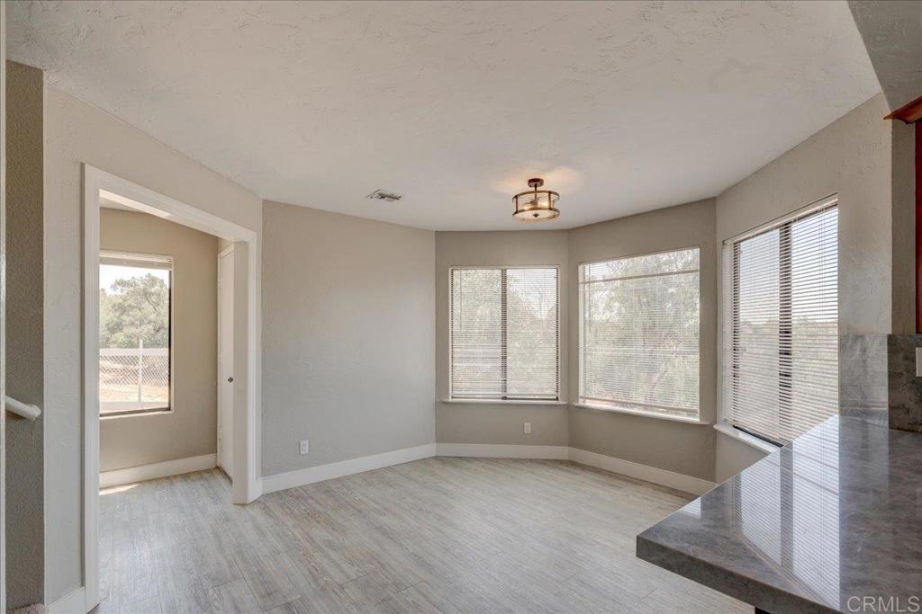18434 Ramona View Drive Ramona, CA 92065 - Photo 23 of 72 a view of an empty room with glass door