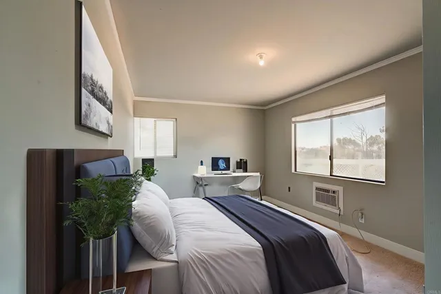 a bedroom with a bed and a window