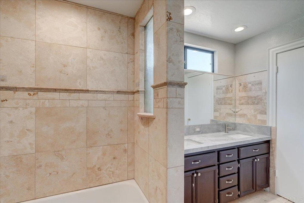 18434 Ramona View Drive Ramona, CA 92065 - Photo 35 of 72 a bathroom with a granite countertop shower sink and mirror
