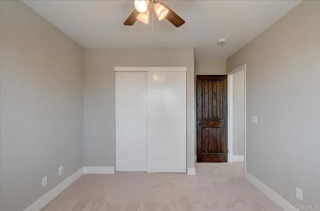 an aerial view of houses with a street