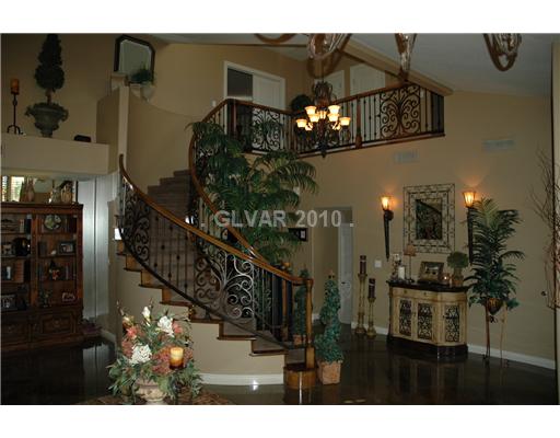 181 Springfield Street Henderson, NV 89074 - Photo 5 of 25 Living Room. shows hallway, stairway to 2nd. floor