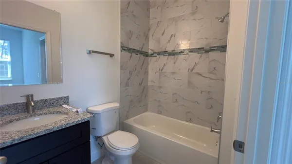 a bathroom with a shower and a toilet