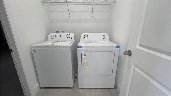 a view of an empty room with a fireplace