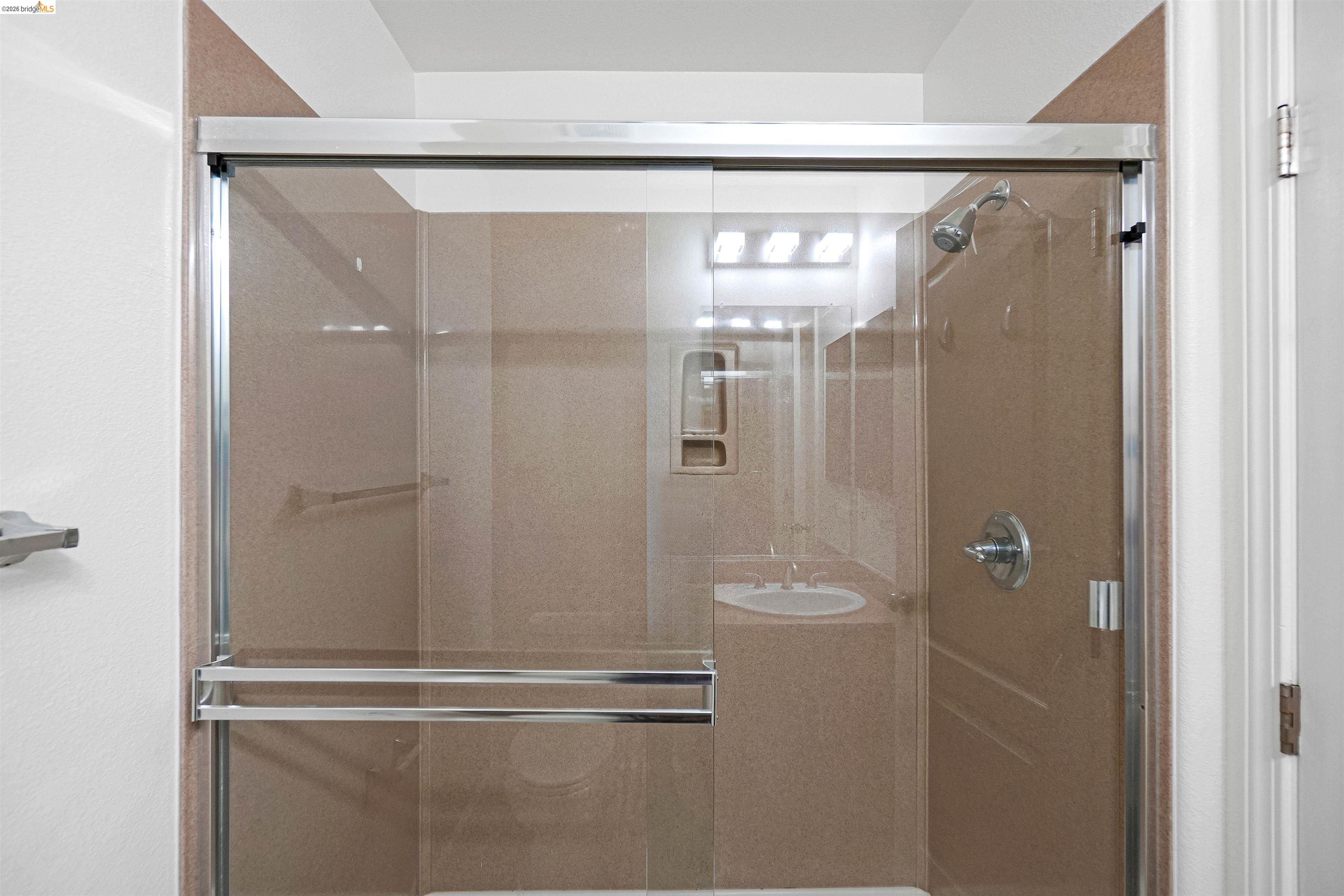 449 Constantine Court San Ramon, CA 94583 - Photo 52 of 63 Enclosed shower with sliding glass doors and chrome hardware