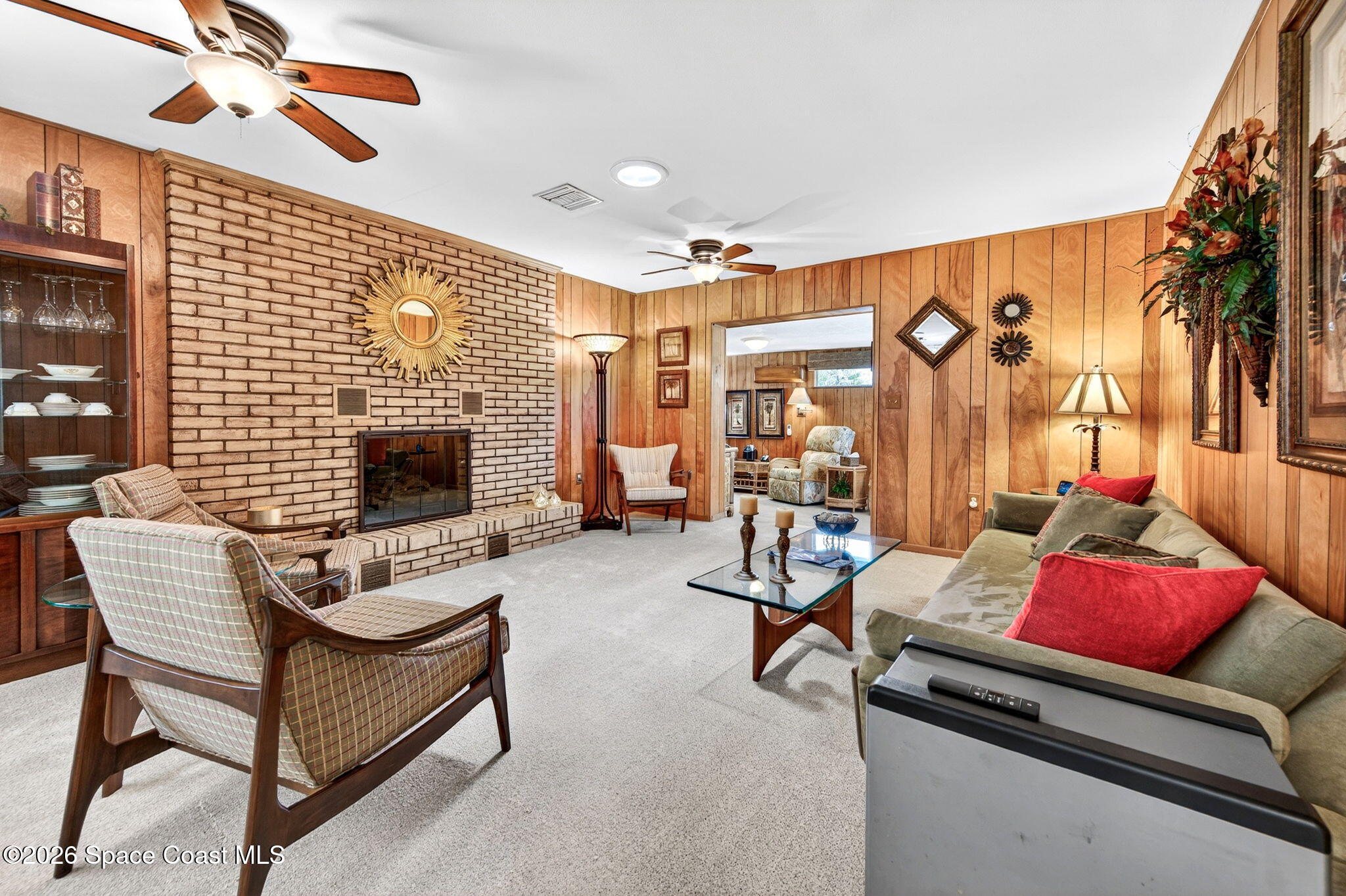 935 Samar Road Cocoa Beach, FL 32931 - Photo 5 of 22 a living room with furniture and a flat screen tv