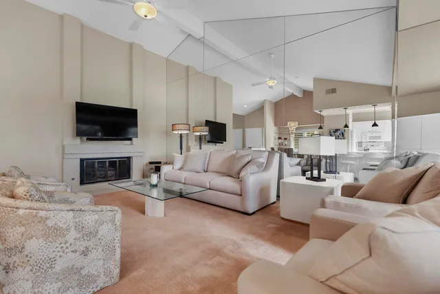 a bedroom with a bed and a flat tv screen