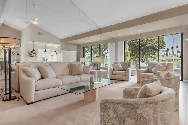 a bedroom with furniture and a flat screen tv