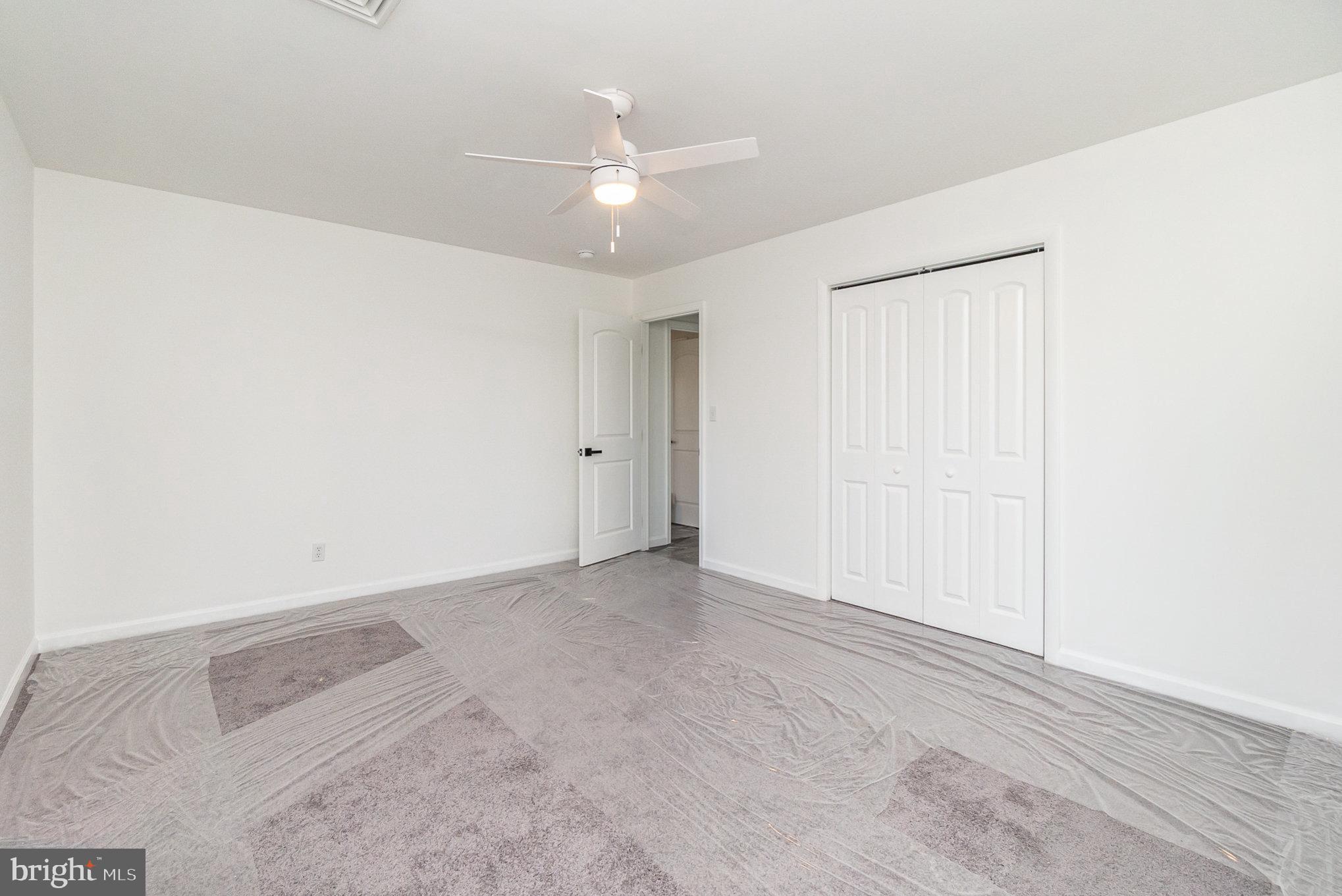 5505 Williams Road Hydes, MD 21082 - Photo 16 of 42 an empty room with a ceiling fan and a window