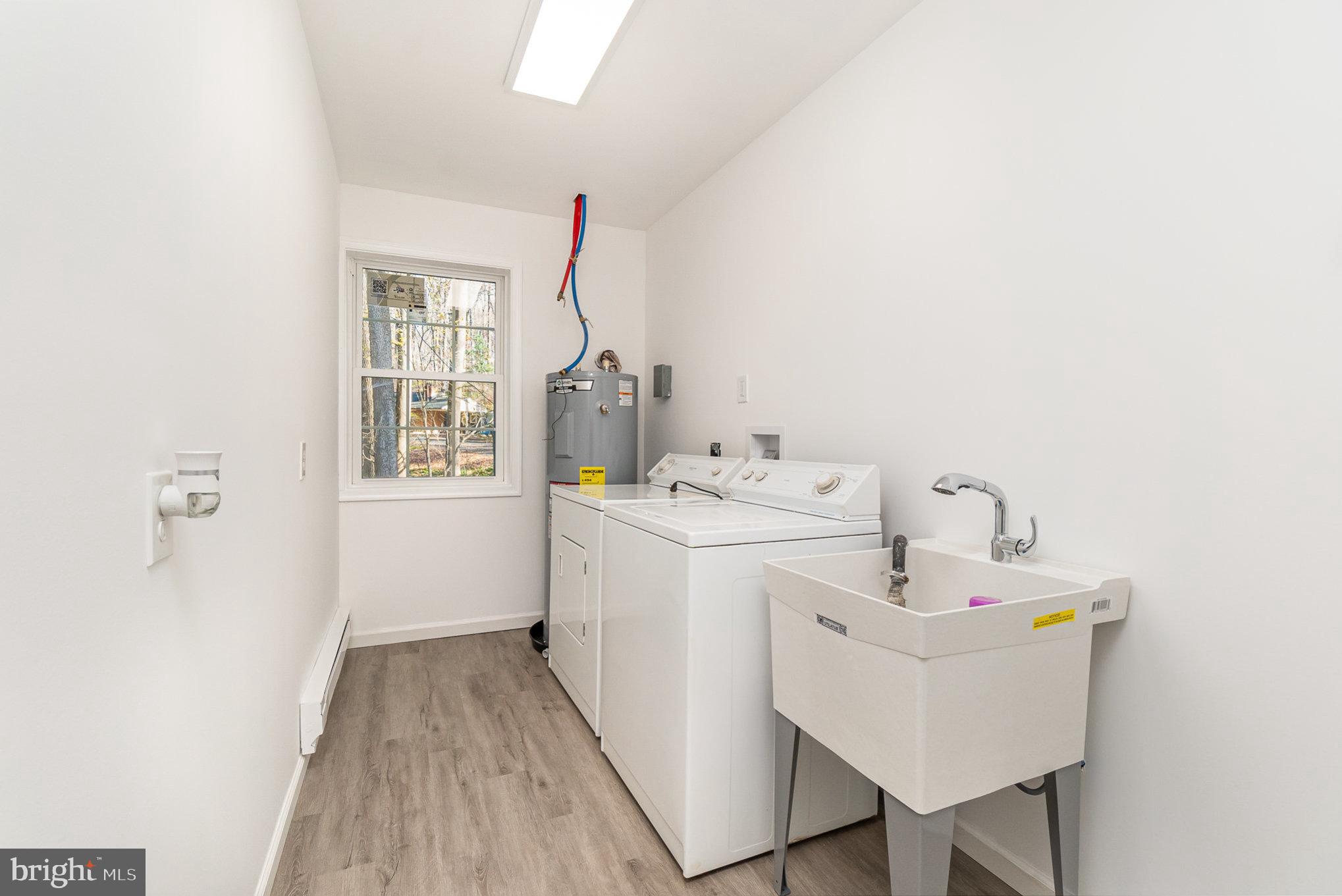 5505 Williams Road Hydes, MD 21082 - Photo 25 of 42 a bathroom with a sink and a mirror