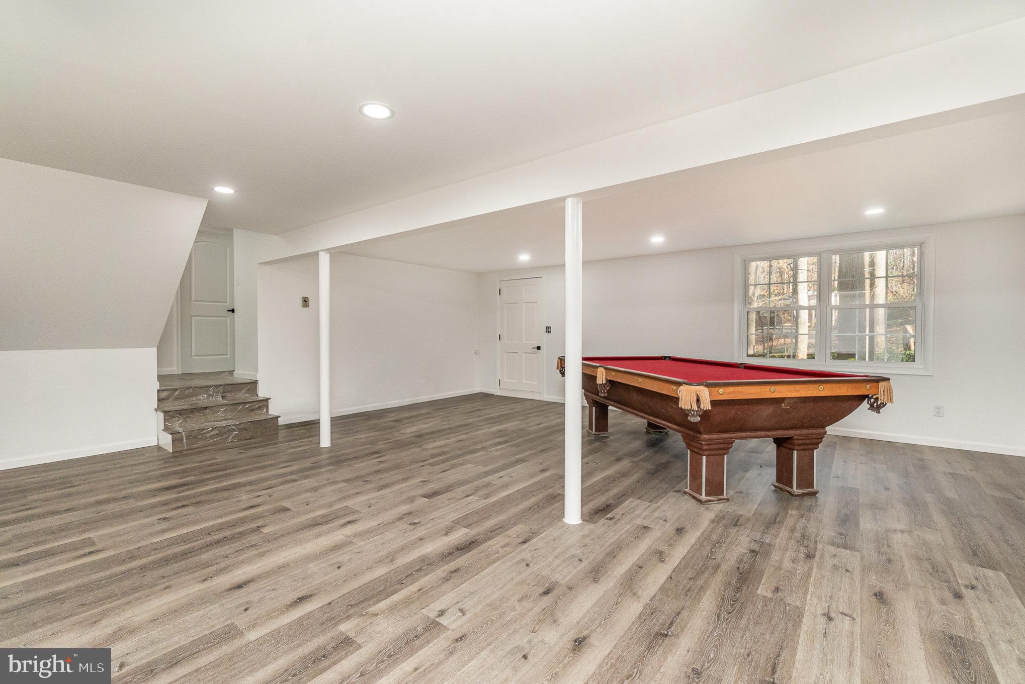 5505 Williams Road Hydes, MD 21082 - Photo 30 of 42 a room with wooden floor pool table and windows
