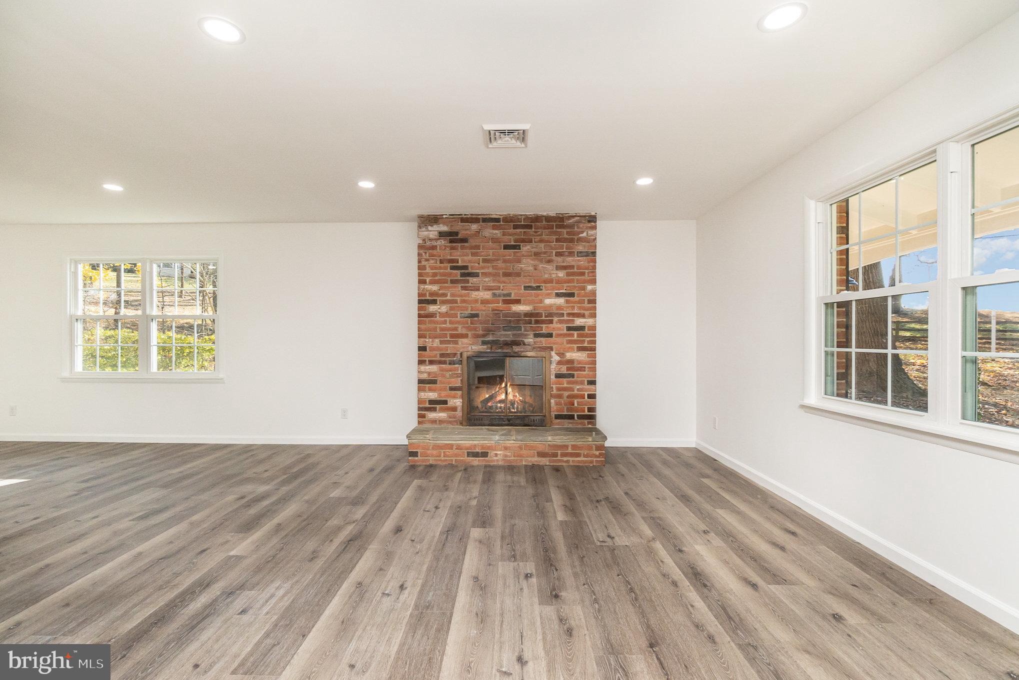 5505 Williams Road Hydes, MD 21082 - Photo 32 of 42 a view of an empty room with wooden floor and a window