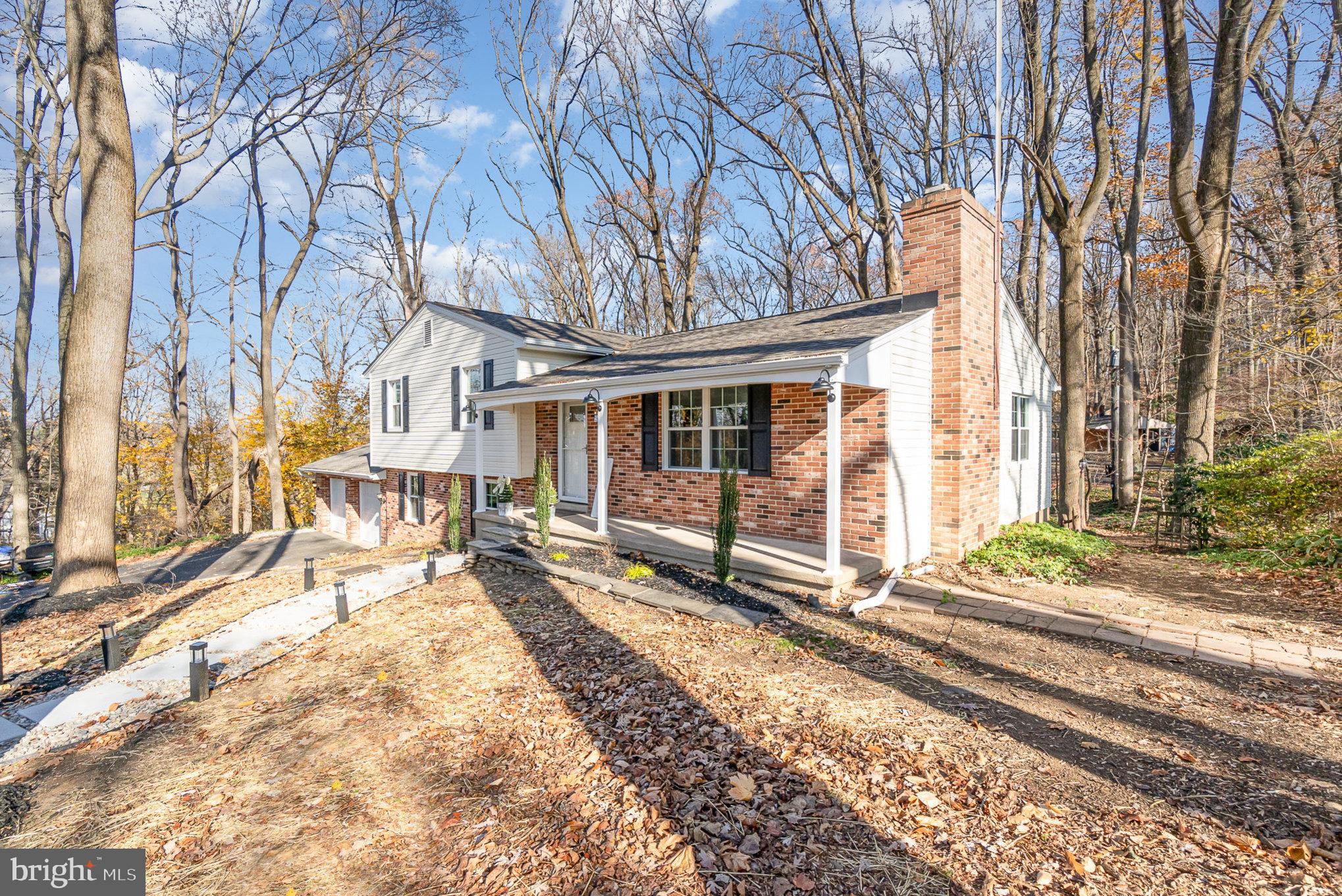 5505 Williams Road Hydes, MD 21082 - Photo 5 of 42 a view of a house with a large tree in the roadside