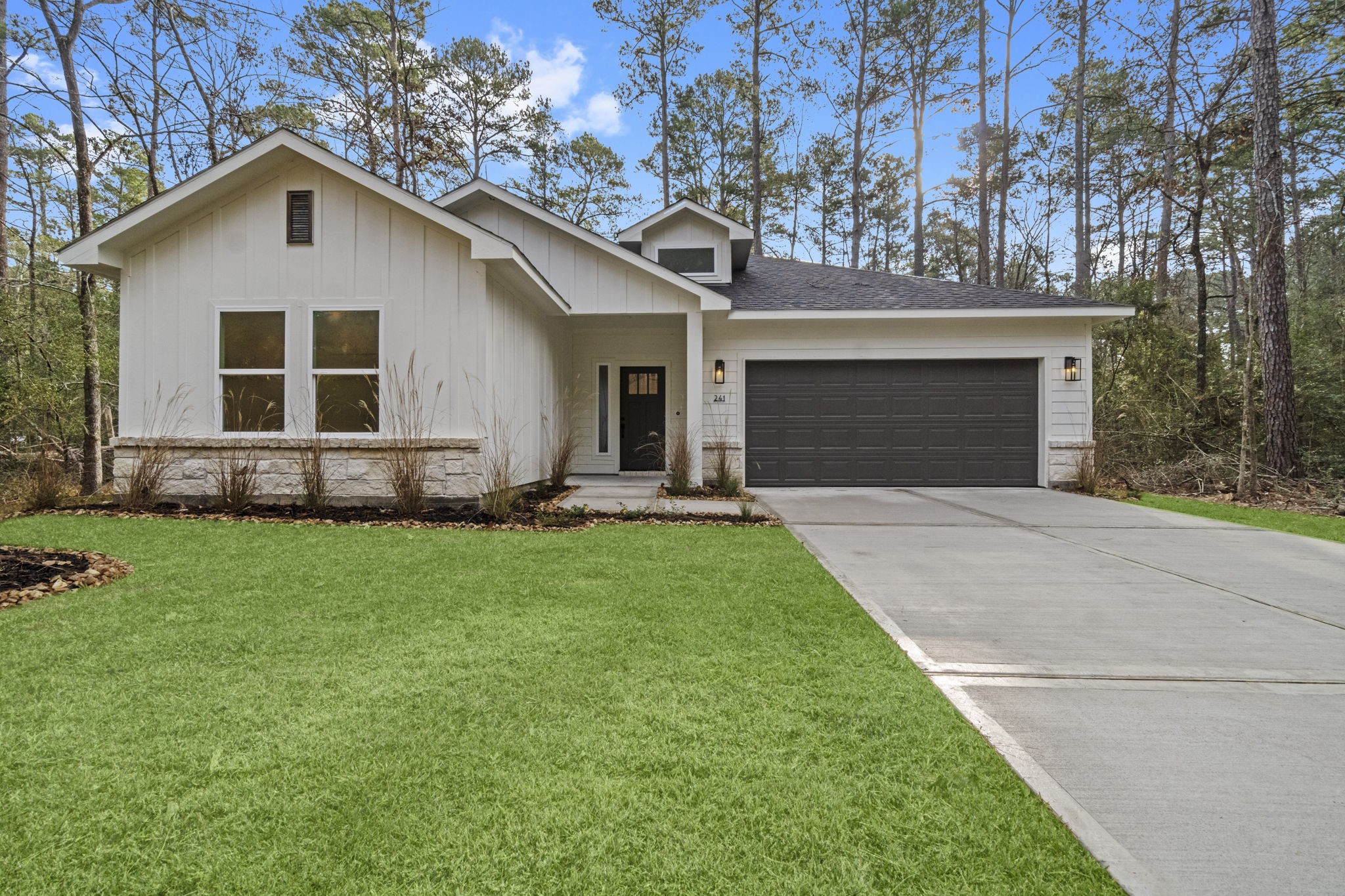 241 Clear Springs Trinity, TX 75862 - Photo 1 of 46 a front view of a house with a yard and garage