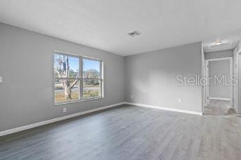 1533 North Normandy Boulevard Deltona, FL 32725 - Photo 11 of 15 an empty room with windows and closet