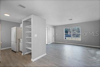 1533 North Normandy Boulevard Deltona, FL 32725 - Photo 5 of 15 a view of an empty room with a window