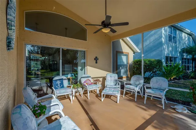 a view of a patio with a table chairs and backyard