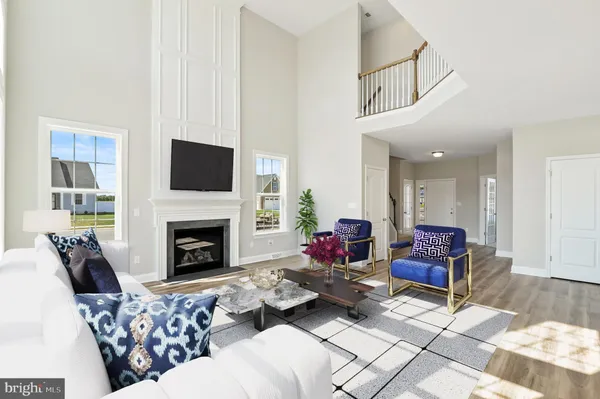 a living room with furniture fireplace and flat screen tv