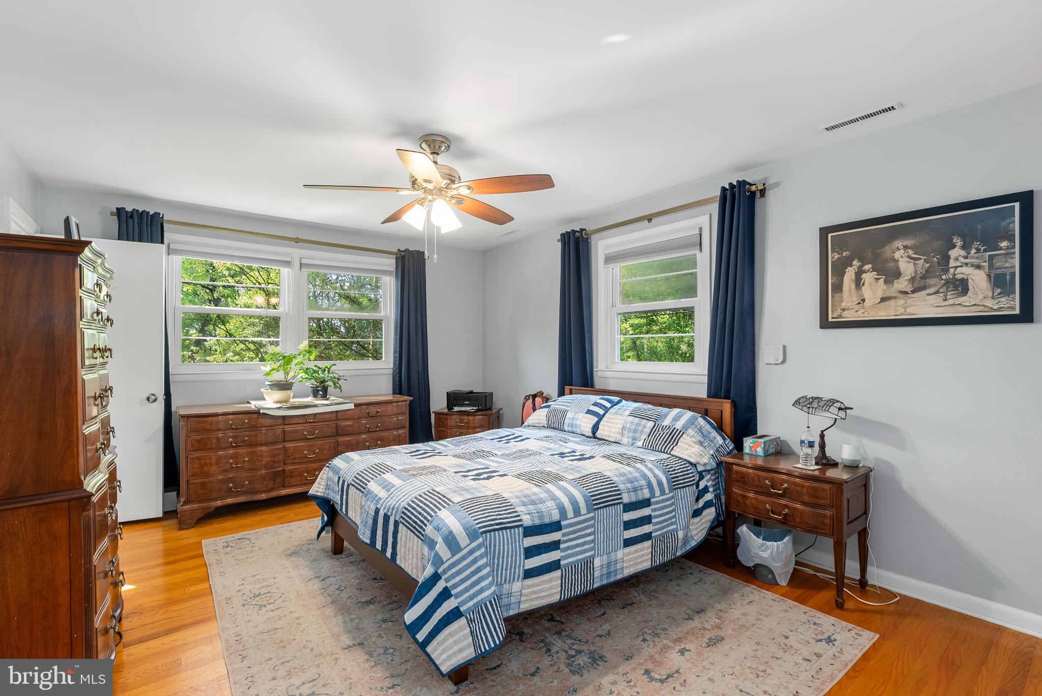1201 Providence Road Towson, MD 21286 - Photo 13 of 35 a bedroom with a bed and a chandelier