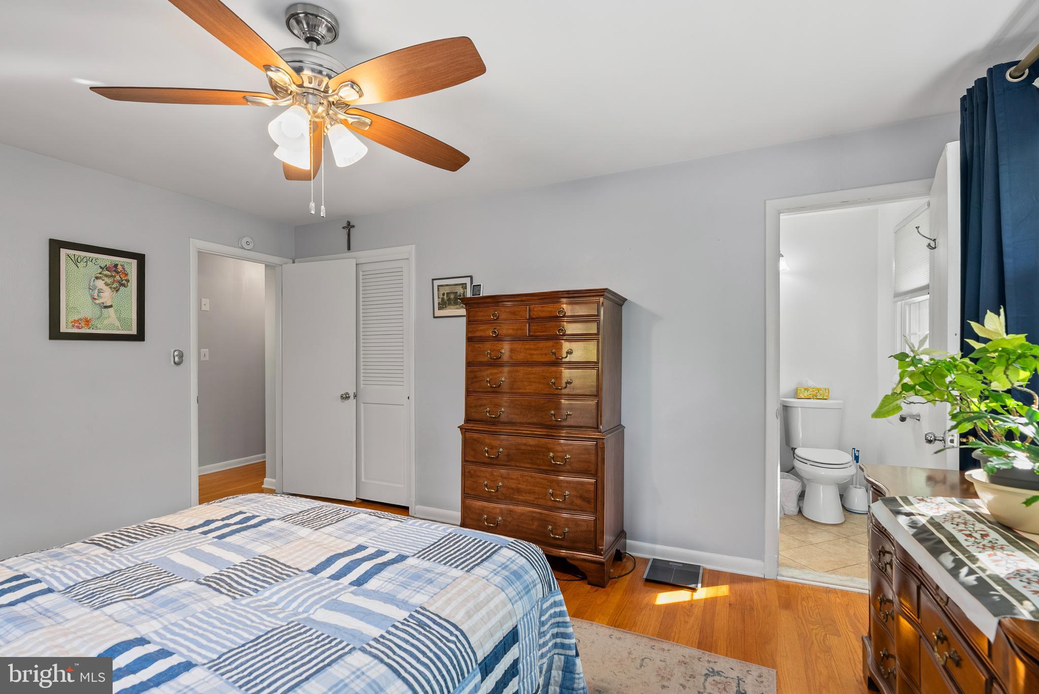 1201 Providence Road Towson, MD 21286 - Photo 14 of 35 a bedroom with a bed and a chandelier
