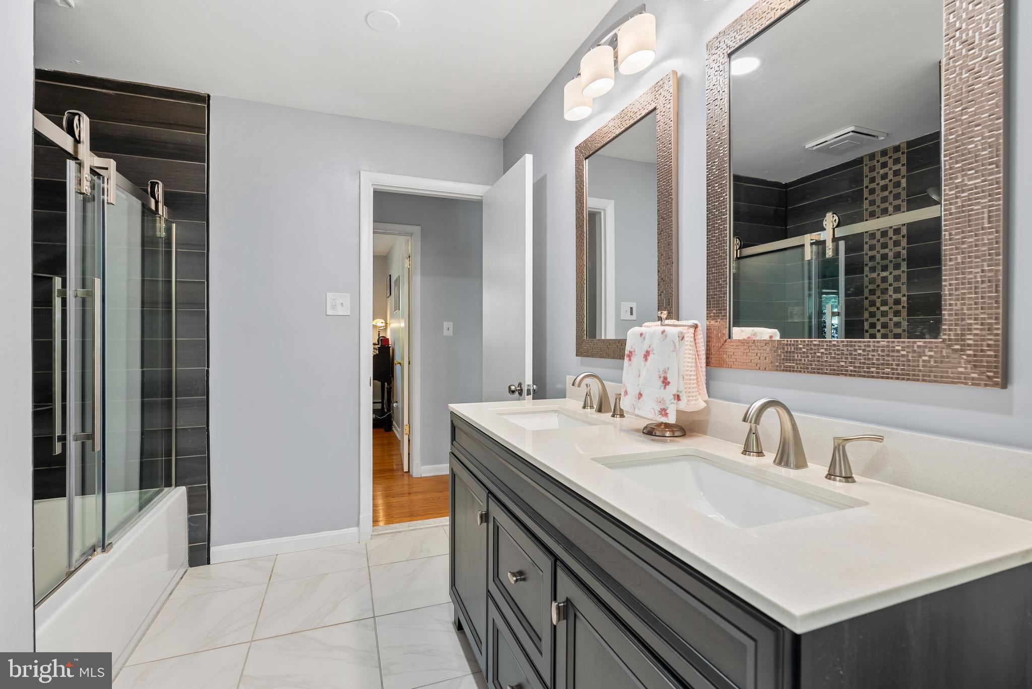 1201 Providence Road Towson, MD 21286 - Photo 19 of 35 a bathroom with a sink and a mirror