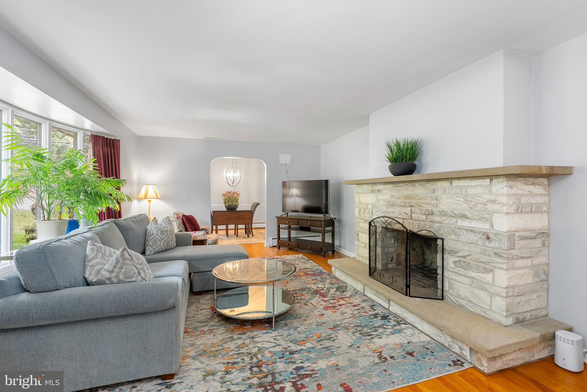 1201 Providence Road Towson, MD 21286 - Photo 2 of 35 a living room with furniture a fireplace and a potted plant