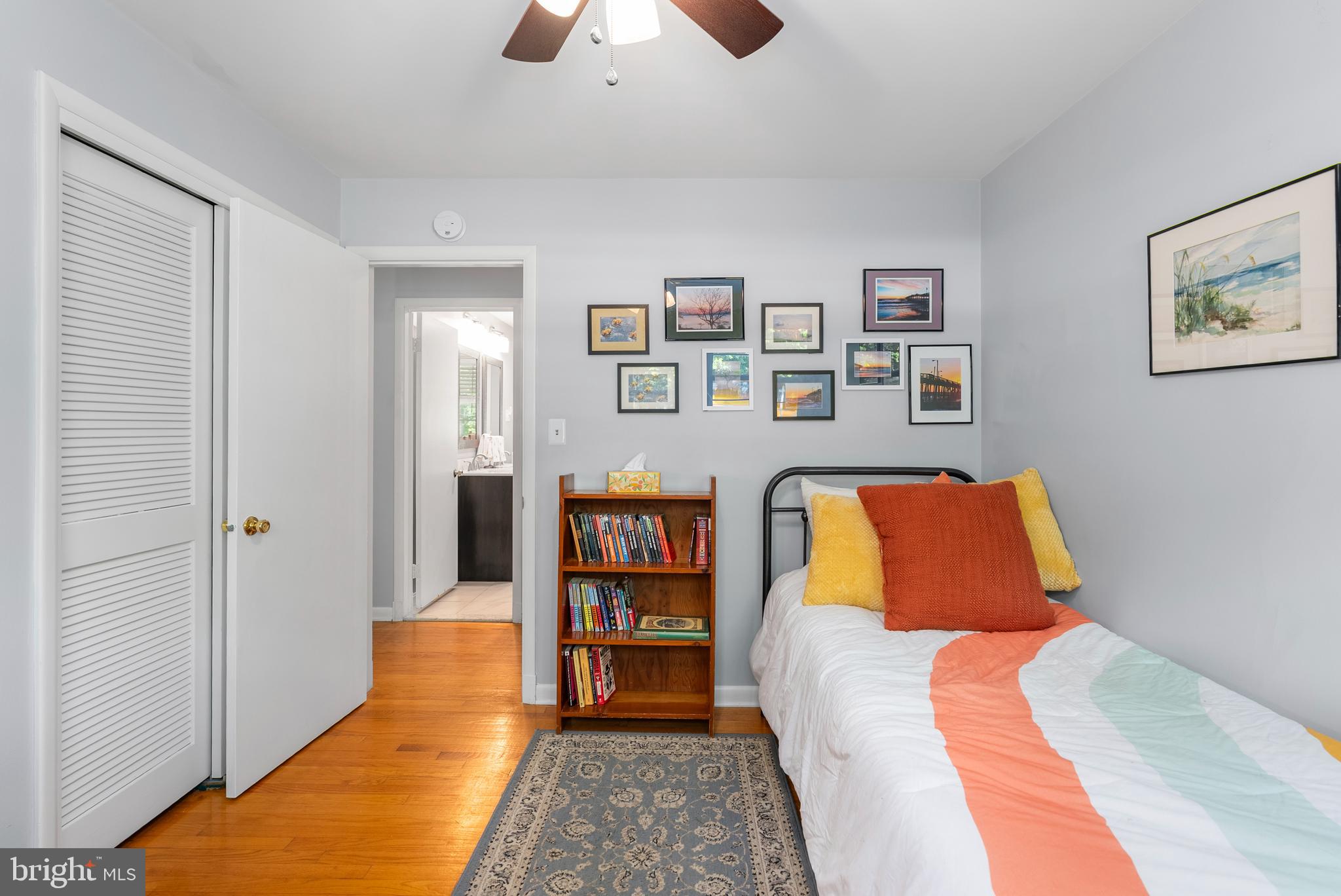 1201 Providence Road Towson, MD 21286 - Photo 21 of 35 a bedroom with a bed and a book shelf