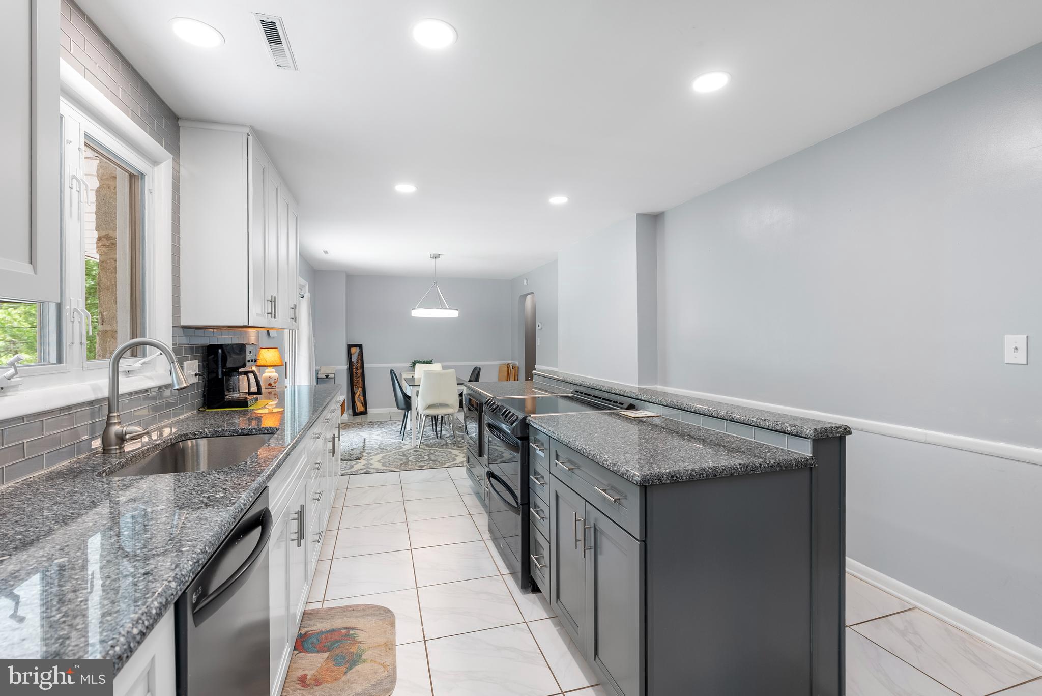 1201 Providence Road Towson, MD 21286 - Photo 6 of 35 a large kitchen with granite countertop a sink and a stove