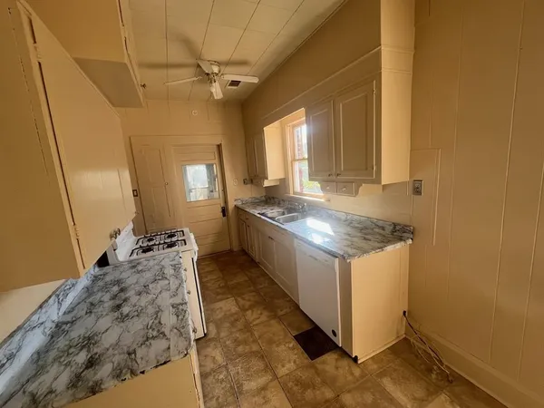 a kitchen with a stove and a sink