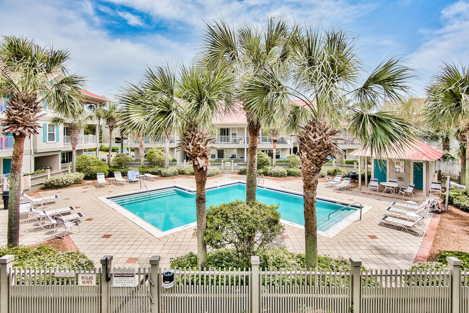 82 Sugar Sand Lane, Unit A7 Santa Rosa Beach, FL 32459 - Photo 14 of 35 a front view of multi story residential apartment building with yard and sign board