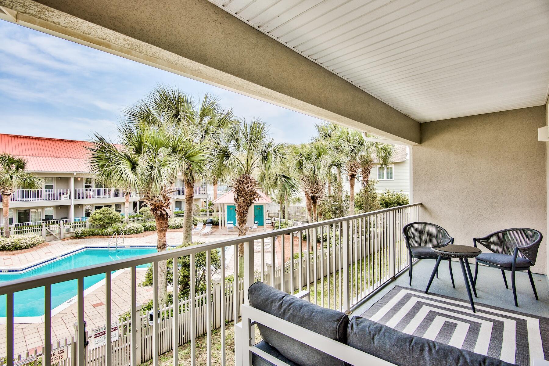 82 Sugar Sand Lane, Unit A7 Santa Rosa Beach, FL 32459 - Photo 20 of 35 a view of an chairs and tables in the balcony