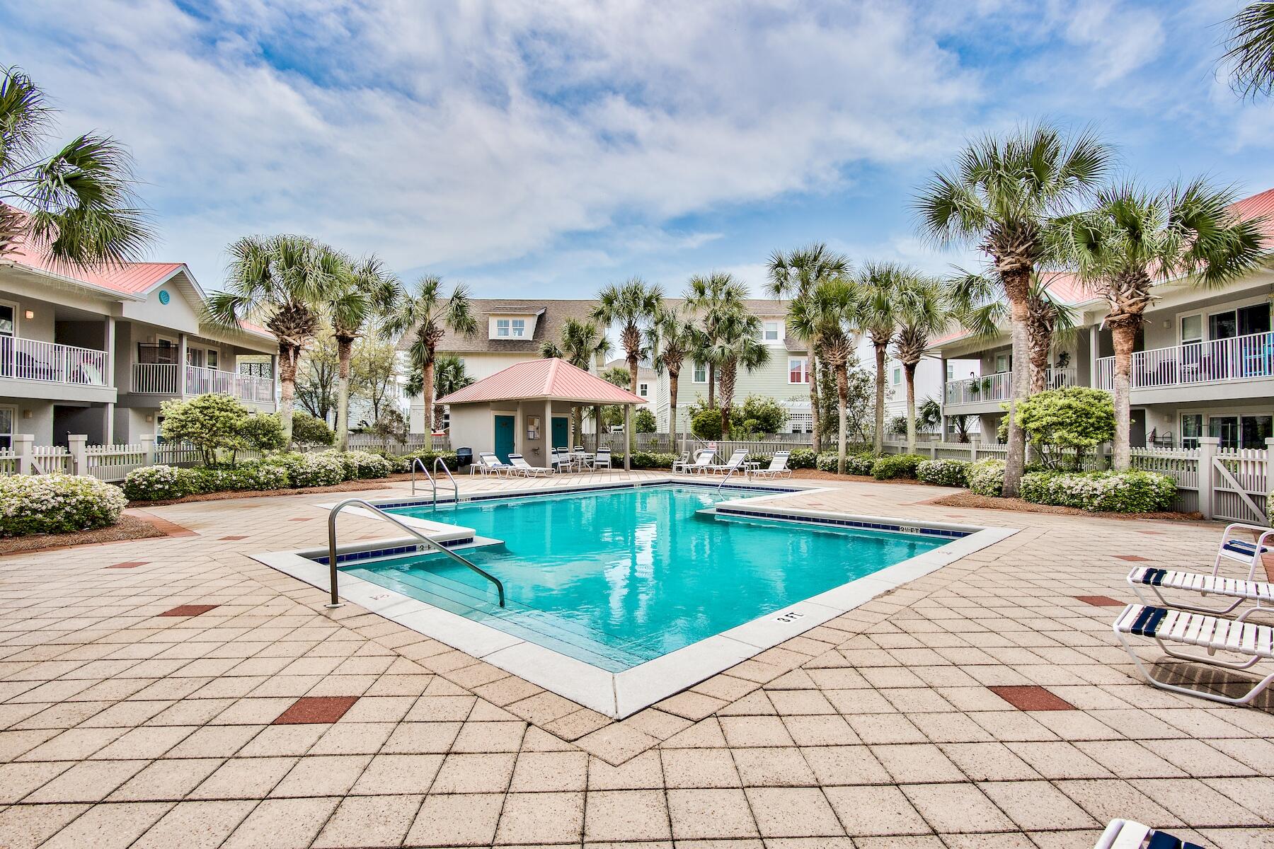 82 Sugar Sand Lane, Unit A7 Santa Rosa Beach, FL 32459 - Photo 22 of 35 a view of a swimming pool and lounge chairs